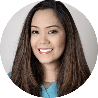 A woman with long hair and a blue shirt.