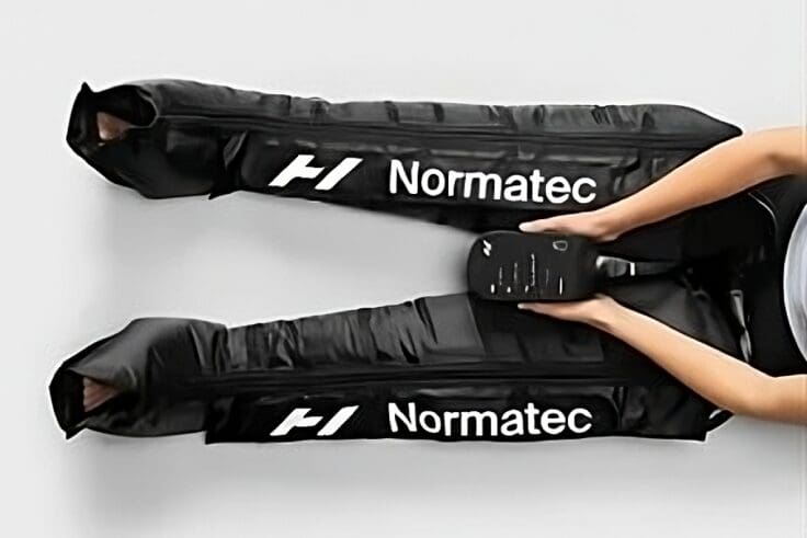 A person holding onto the handles of skis.